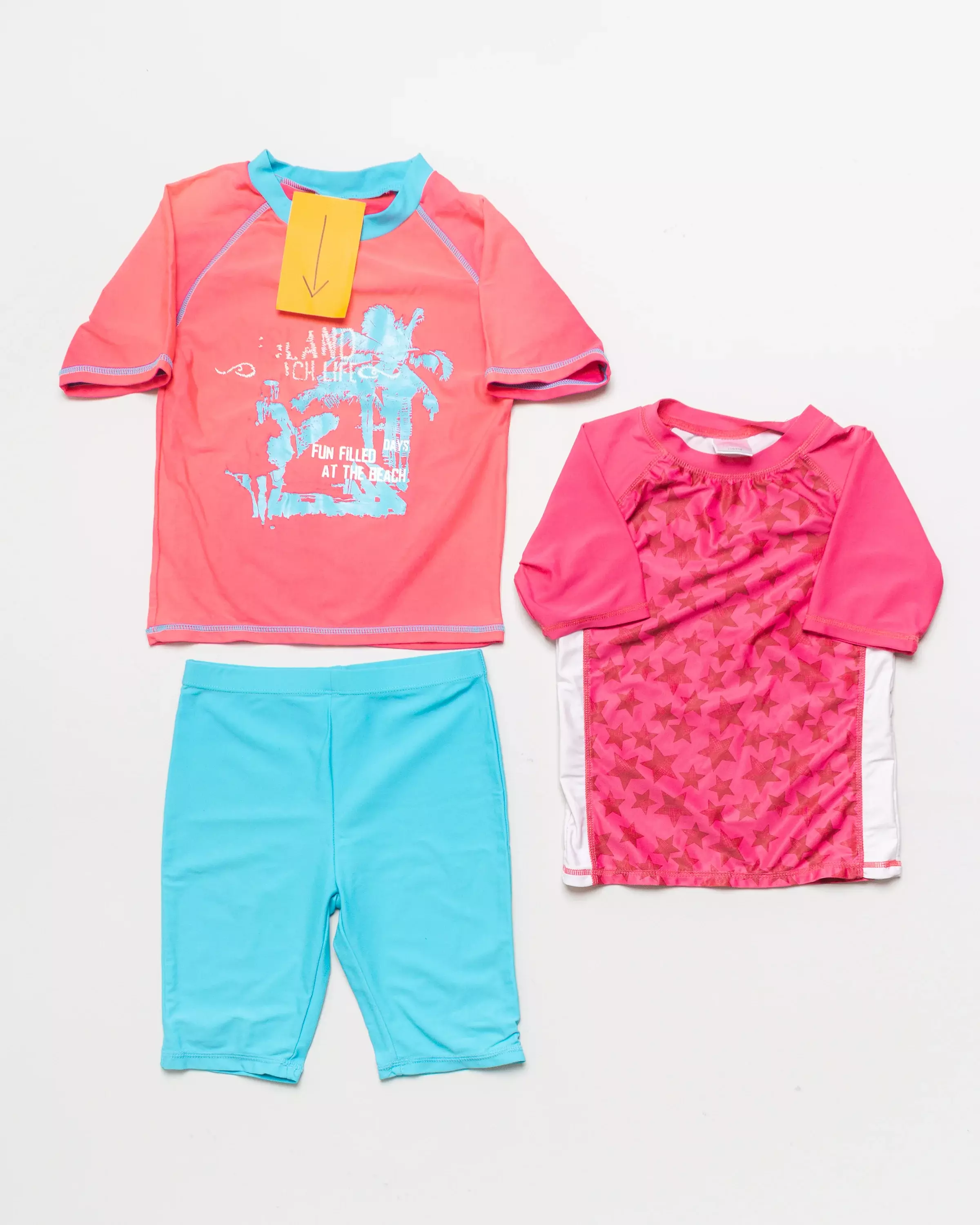2 UV Schutz T-Shirts Gr. 110/116 – Strand pink Sterne blau Shorts Radler Set Pack